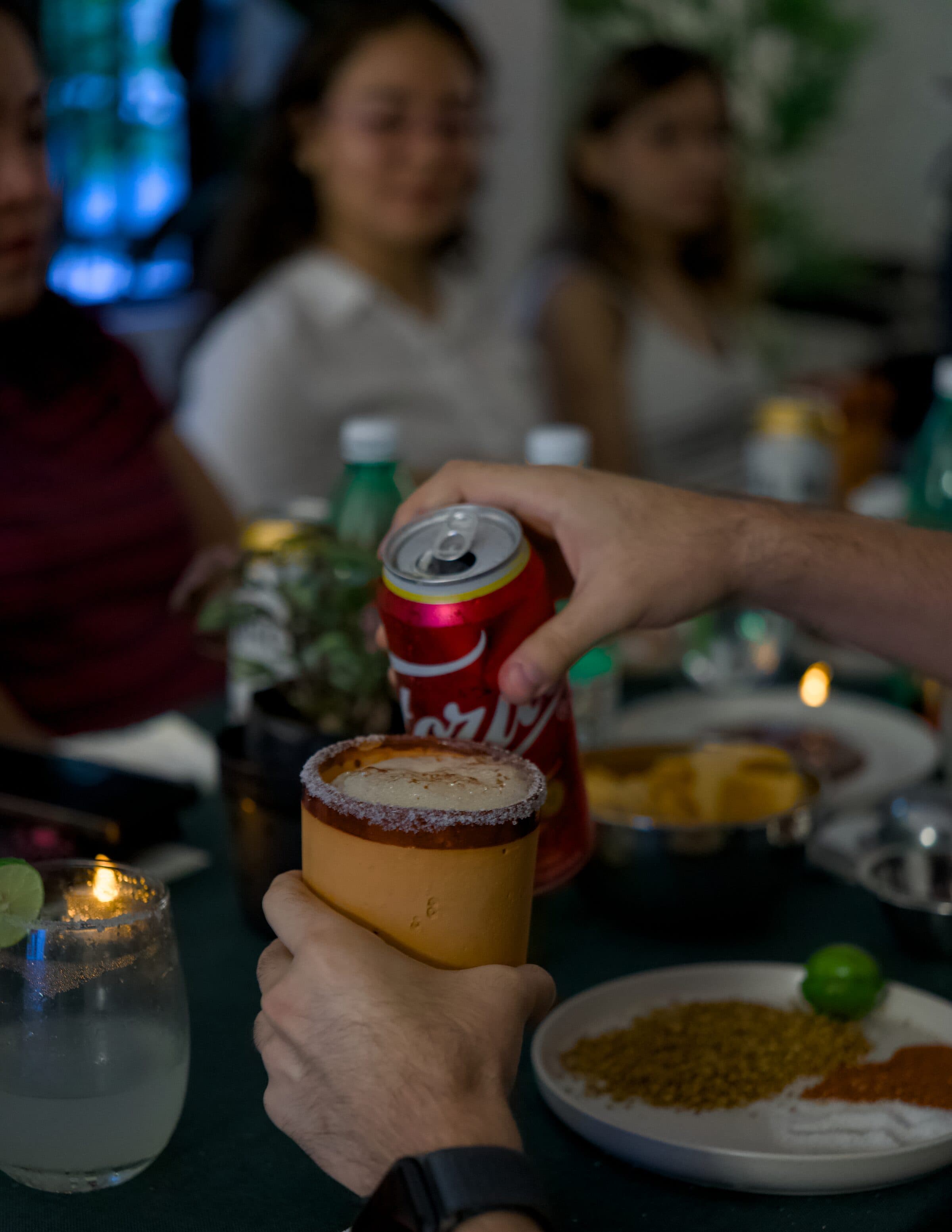 Pouring the soda into the michelada